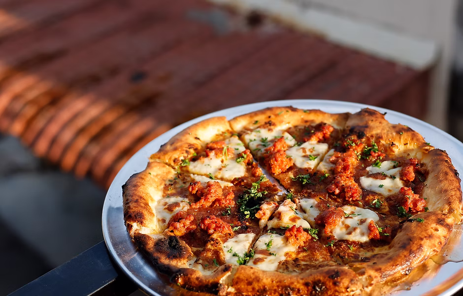 The Certified Banger pie, house-smoked meat on hand-stretched crust